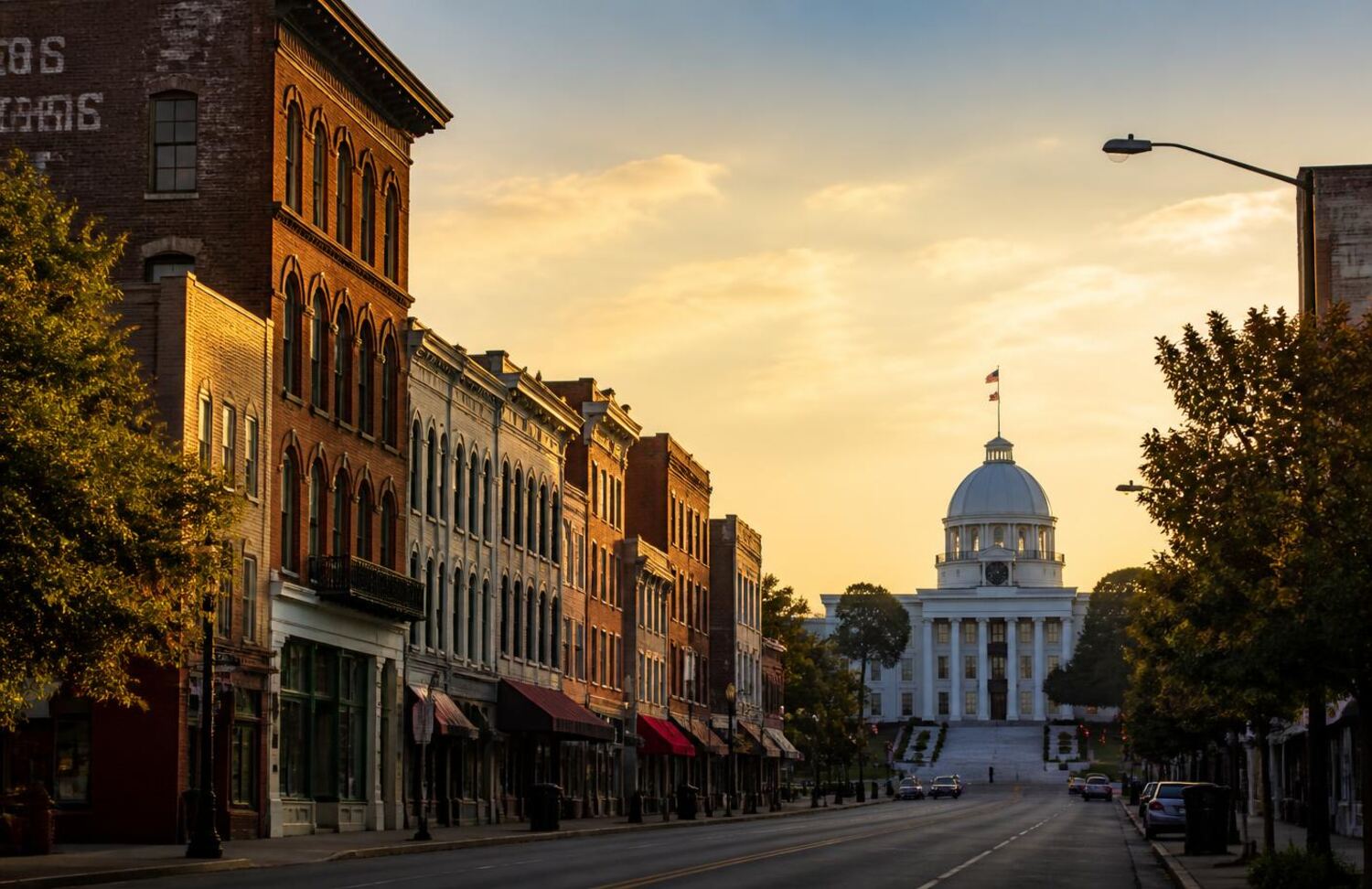 Downtown Montgomery, Alabama at golden hour with the state capitol dome in the distance